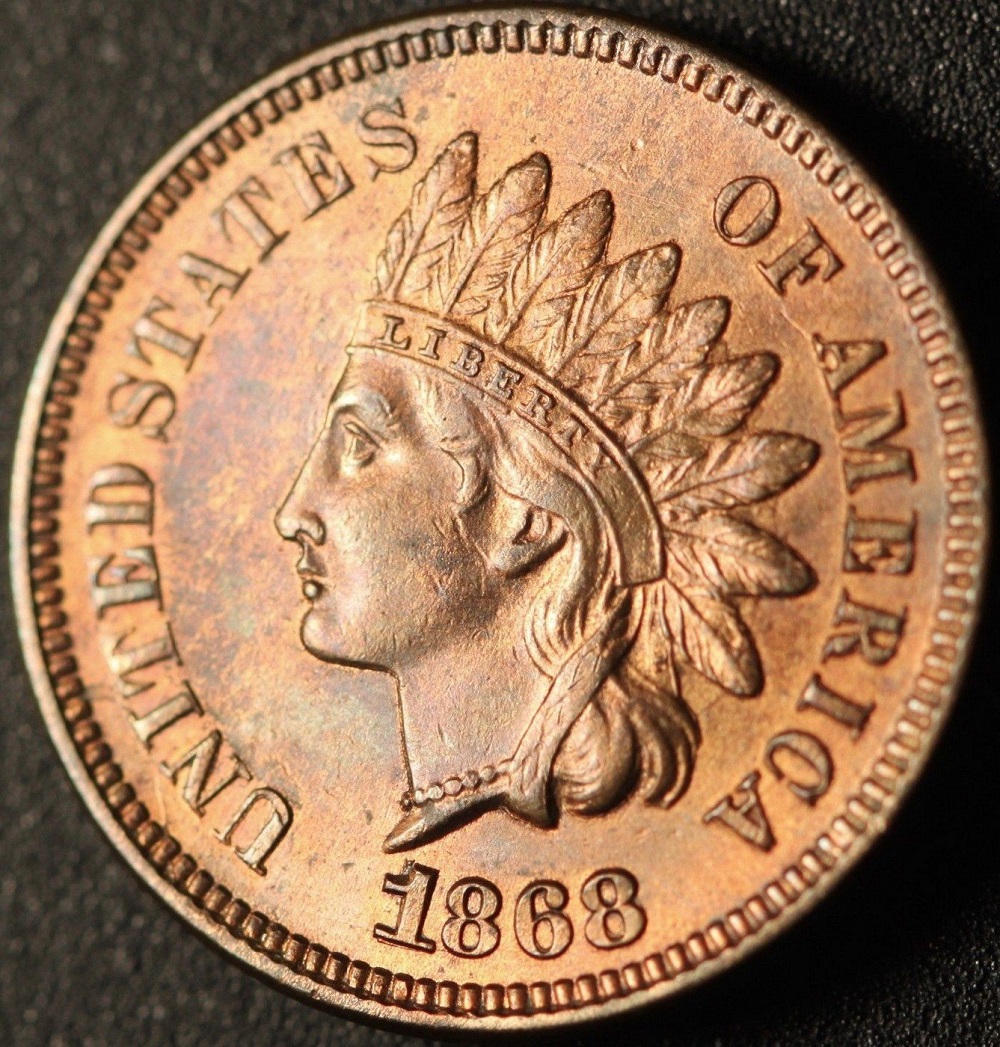 Close-up of 1868 Indian Head Penny date area showing repunched date RPD variety with secondary digit impressions below primary numerals