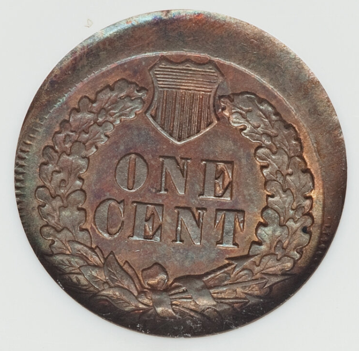 1868 Indian Head Penny off-center or misaligned die strike error showing shifted design with blank planchet crescent visible at coin edge